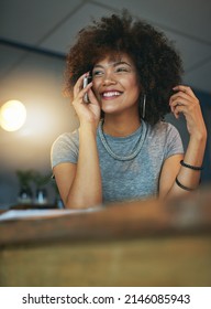 I Love The Vibe In The Office Late At Night. Shot Of A Young Woman Talking On The Phone During A Late Shift At The Office.