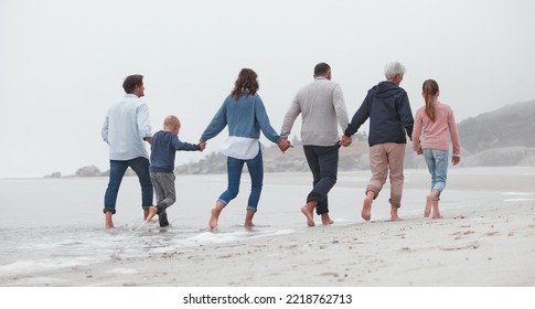 Love, Walking And Family Holding Hands On The Beach, Bond Or Enjoy Fun Quality Time Together On Vacation Back View. Support Trust, Peace And Big Family Travel On Canada Adventure Holiday For Freedom