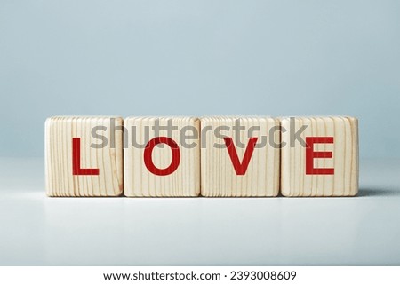 Love word written on wooden cubes.