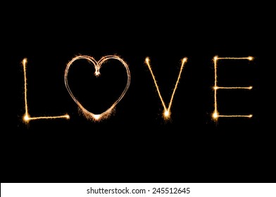 Love Writing By Sparkler Firework Isolated On Black Background For Valentines Day