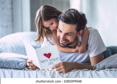 I love you, dad! Handsome young man at home with his little cute girl. Happy Father's Day! - Shutterstock ID 1085099048