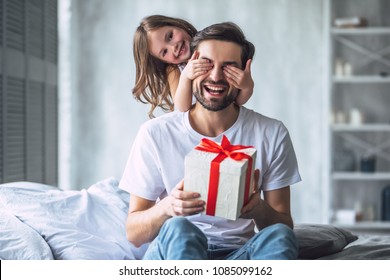 I love you, dad! Handsome young man at home with his little cute girl. Happy Father's Day! - Shutterstock ID 1085099162