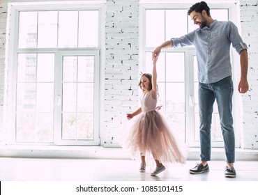 I Love You, Dad! Handsome Young Man Is Dancing At Home With His Little Cute Girl. Happy Father's Day!