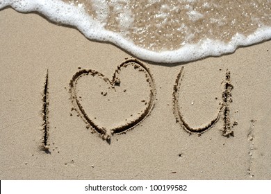 I love you handwritten in sand for natural, love,tourism or conceptual designs
