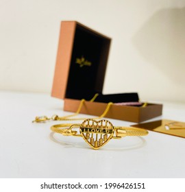 I Love You Heart Shape Abacus Gold Bracelet With Jewellery Box And Violet Flower As A Prop.