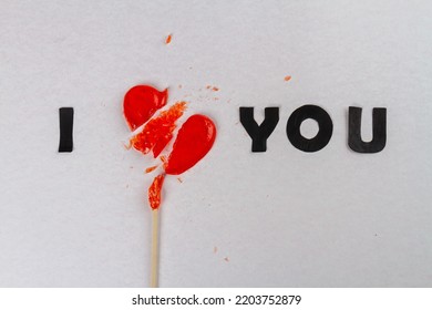 I love you inscription with broken heart lollipop. Divorce or broke up concept. I dont love you anymore.
