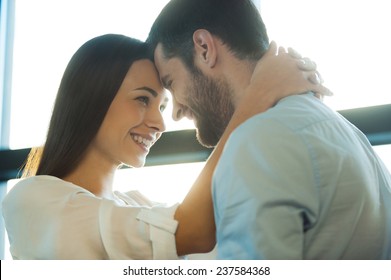 I Love You So Much! Beautiful Young Loving Couple Bonding To Each Other And Smiling While Woman Embracing Her Boyfriend