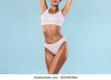 Love Yourself, Body Neutrality. Positive Slim Lady With Perfect Ideal Shape And Appearance Posing Isolated On Blue Studio Background, Lady In White Underwear Enjoying Herself, Free Copy Space, Banner