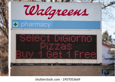 Loveland, Colorado, USA - January 31, 2021.  Walgreen's sign promoting specials. Sign with company name and advertising.  LED lighting with for sale item.
