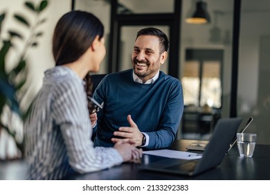 Lovely Adult Man, Sharing Stories With His Office Partner.