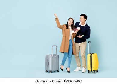 Lovely Asian Couple Tourists With Baggage Passports And Boarding Passes About To Go For Honeymoon Travel