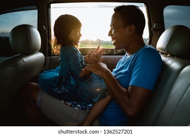 Lovely Asian Daughter With Father In The Car Playing Together Laughing