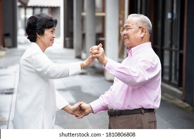 Lovely Asian Senior Couple Dancing Together