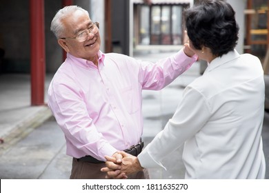 Lovely Asian Senior Couple Dancing Together