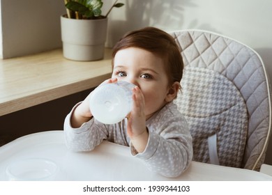 Lovely Baby Boy Age Of 1 Year Drinking Milk From A Small Bottle, Kids Breakfast Food Side View