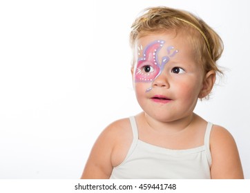 lovely baby girl with paintings on her face of a butterfly