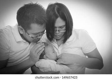 lovely baby with Parents  in home