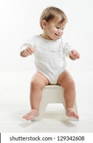 Lovely Baby Sitting In Chair