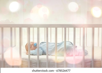 Lovely Baby Sleeping In Cradle At Home