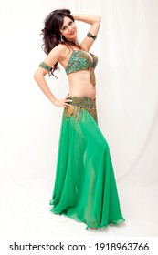 Lovely beautiful amazing bellydancer woman portrait with bellydance lush dress outfit dancing and smile posing with pretty face and body curves