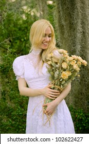 Lovely Blonde Female In Vintage Wedding Gown At Outdoor Nature Preserve