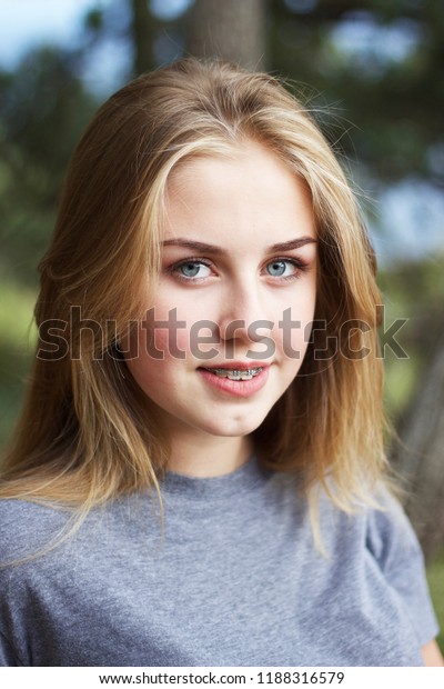 Lovely Blondehaired Blueeyed Teenage Girl Smiling Stock Photo