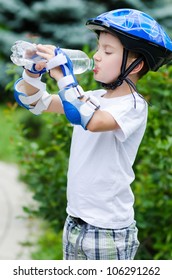 The Lovely Boy Skater Drinking Water From A Bottle