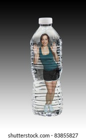 A Lovely Brunette Wearing Fitness Wear, Inside A Generic Bottle Of Water.   Generous Copyspace.