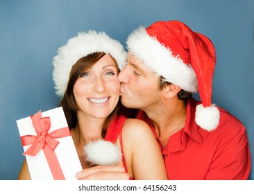 Lovely Christmas Couple Holding Presents