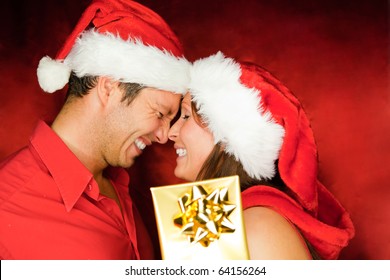 Lovely Christmas Couple Holding Presents