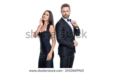 Similar – Image, Stock Photo A fashionable couple, dressed in white and wearing avant-garde shoes, is having some fun in the green meadow. With a cow. It’s a great outdoor wanderlust at its best. On a wild summer night.