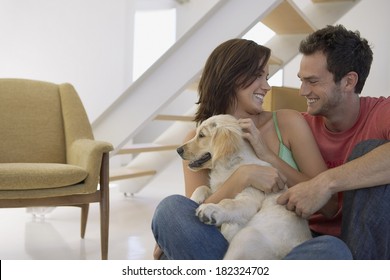 Lovely Couple And Dog At Home