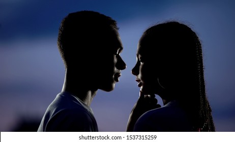 Lovely couple dreaming of romantic kiss in darkness, shy inexperienced teens - Shutterstock ID 1537315259