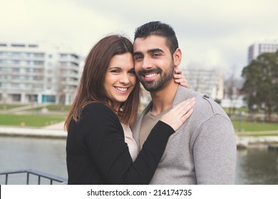 Lovely couple hugging each other in the city