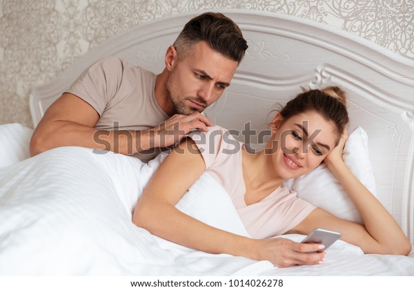 Lovely Couple Lying Together Bed While Stock Photo (Edit ...