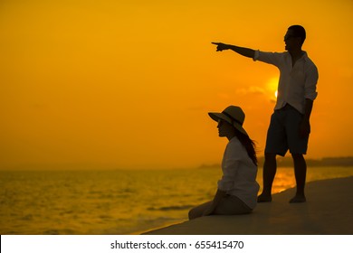 Lovely couple man and woman dating on the sun set beach, Concept of love and wedding