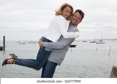 Lovely Couple In Ocean Beach Near Boat