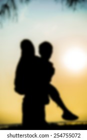 Lovely Couple Piggy Back Ride On Sunset In Silhouette Scene In Blur Style