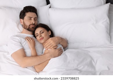 Lovely couple sleeping together in bed at home, top view. Space for text - Powered by Shutterstock