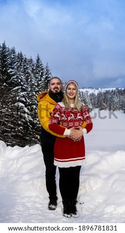 Lovely couple in snowy mountains