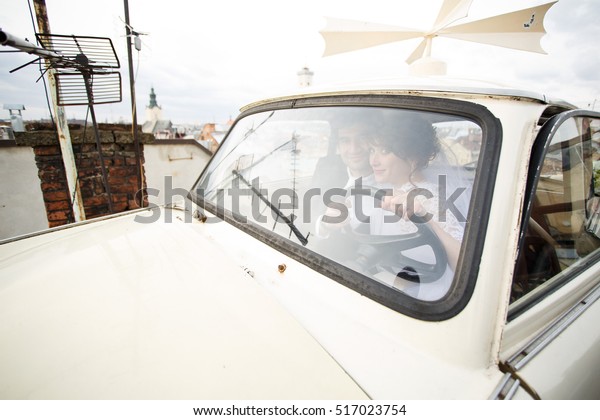 Lovely couple in vintage\
car