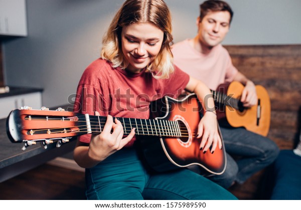 people playing guitar