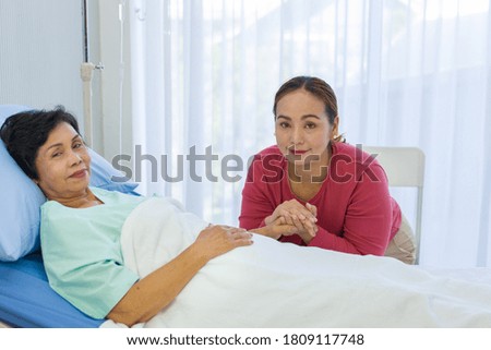 Similar – Female doctor comforting older female patient