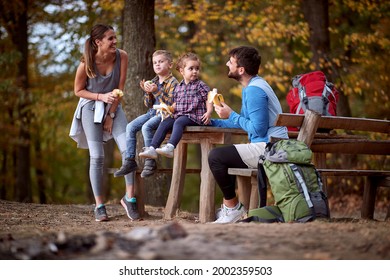 A Lovely Family Having A Break And A Snack On The Hiking On A Beautiful Day