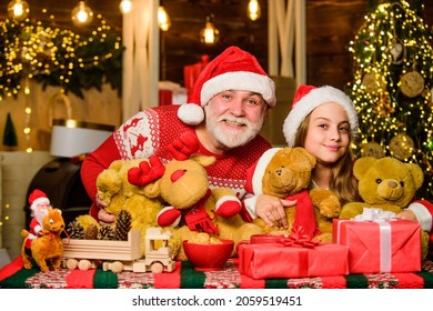 Lovely Gift. Child Enjoy Christmas With Grandfather Santa Claus. Festive Tradition. Happiness And Joy. Happy Childhood. Gift Surprise. Gift Teddy Bear Toy For Kid. Boxing Day. Family Values