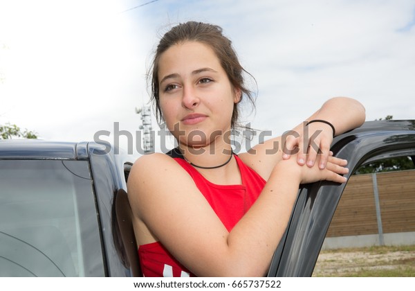 lovely girl with car in\
summer day
