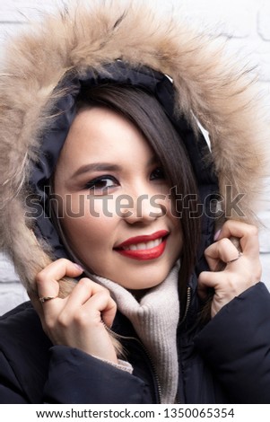 lovely girl in a jacket with fur, fashion girl