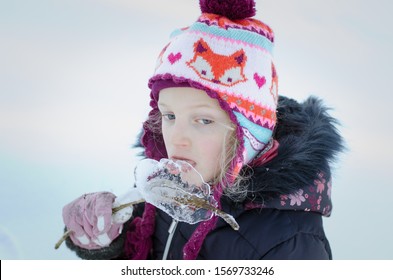 Lovely Girl Licking Frozen Icicle