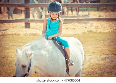 Lovely Girl On A Horse. Child And Aimal. Litlle Girl Riding A Horse In Countryside. 