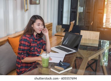 Lovely girl working in the office.
 - Shutterstock ID 605557694